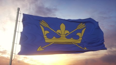 Suffolk flag, England, waving in the wind, sky and sun background