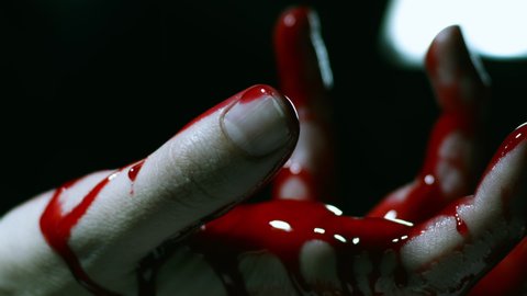 Blood hand with blood dripping into palm Horror Clip
