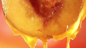 Slow Motion Macro Shot of Flowing Peach Juice from Half Peach - Powered by Shutterstock - Get 15% off with code: PIKWIZARD15