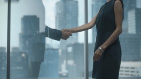 Female and Male Business Partners Meet in Office, Shake Hands. Corporate CEO and Finance Manager Have Meeting in City Office. Businesspeople Came to Discuss Real Estate Purchase and Marketing Project. - Powered by Shutterstock - Get 15% off with code: PIKWIZARD15