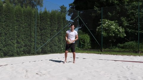 22.07.2021 - Ostrava, Czech republic. Young volleyball player in a white t-shirt and black shorts shows volleyball shots. Young athlete practicing basic volleyball strokes