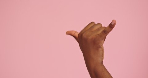 African american man hand shaka gesture isolated on pink background