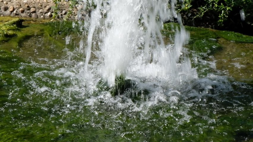 a high fountain bubbles in a well