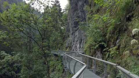 Metal hiking path high above Passer River near Sankt Leonhard, South Tyrol