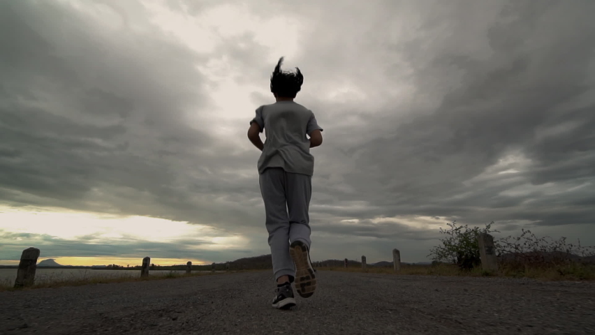 Teenage Girls running in country road., Slow motion
