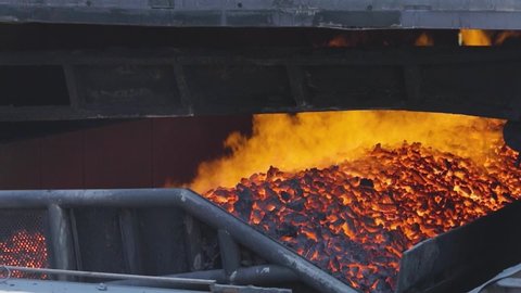 Hot coke coal leaves the furnace. Coal coking process, coke oven coal making process