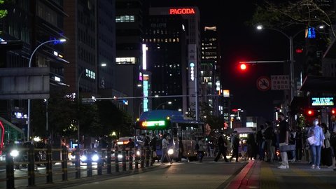  Seoul, South Korea - September 2021: Nighttime view of downtown with people crossing the street