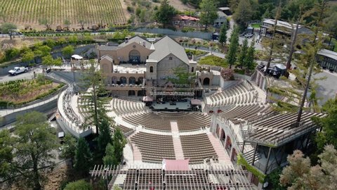 Silicon valley , United States - 09 25 2021: Aerial view away from the empty mountain winery in California - pull back, drone shot