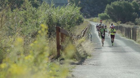 Murcia , Pakistan - 10 05 2019: Runners And Cyclists Under The Sun Participate At 90km Ultra Marathon Race