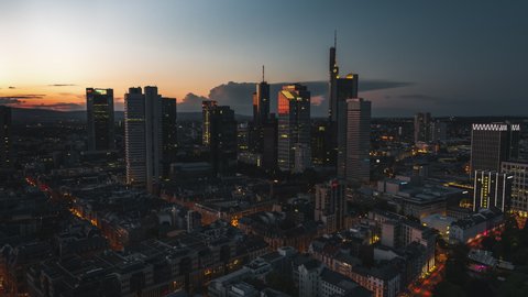 Establishing Aerial View Shot of Frankfurt am Main De, financial capital of Europe, Hesse, Germany, night evening dusk, late sunset, moody orbiting