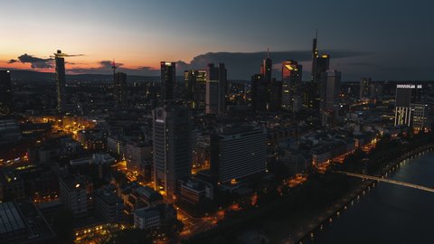 Establishing Aerial View Shot of Frankfurt am Main De, financial capital of Europe, Hesse, Germany, night evening dusk, late sunset, moody track along