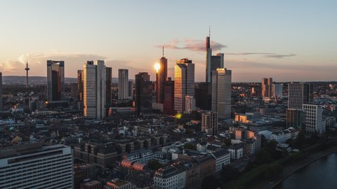 Golden Sunset, Establishing Aerial View Shot of Frankfurt am Main De, financial capital of Europe, Hesse, Germany, track in with superb reflection