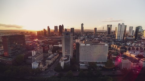 Golden Sunset, Establishing Aerial View Shot of Frankfurt am Main De, financial capital of Europe, Hesse, Germany, wide cityskape, flares and sun