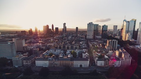 Golden Sunset, Establishing Aerial View Shot of Frankfurt am Main De, financial capital of Europe, Hesse, Germany, wide cityskape, flares