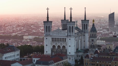 Establishing Aerial View Shot of Lyon Fr,  Auvergne-Rhone-Alpes, France, morning light on Basilica of Notre Dame de Fourviere, strong push in with paralaxe