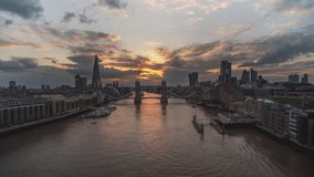 Golden shuttered sunset, Establishing Aerial View Shot of London UK, United Kingdom, track in