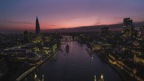 Purple Sunset, Establishing Aerial View Shot of London UK, United Kingdom, pull back, revealing shot