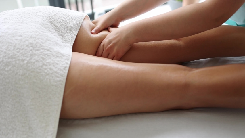 Anti-cellulite massage in the spa salon. The masseur massages the buttocks, thigh and legs. Relaxing treatment. Slimming and body shaping. Healthy body and skin. Self love care	 | Shutterstock HD Video #1079898830