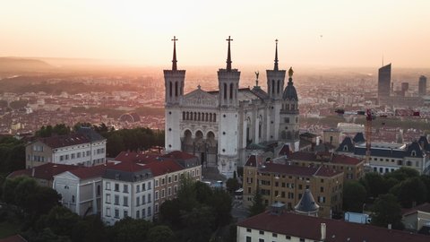Lyon, France - circa 2021: Establishing Aerial View Shot of Lyon Fr,  Auvergne-Rhone-Alpes, France, morning light on Basilica of Notre Dame de Fourviere, soft sunshine 