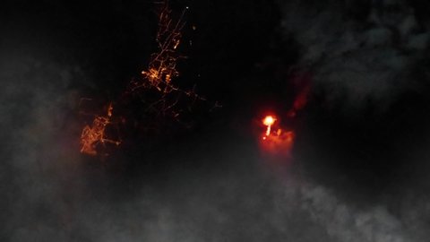 Volcano eruption with flame and smoke night aerial satellite view of La palma in Canary Islands. Images furnished by Nasa