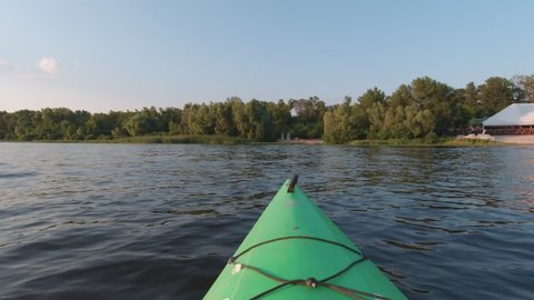 Kayak floats to the shore slow motion POV