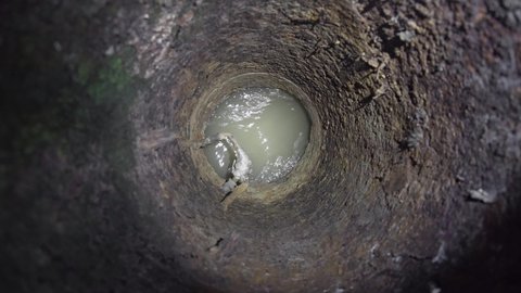 Inside the old karstic sewer, in which sewage waste flows.