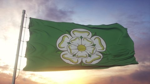North Yorkshire flag, England, waving in the wind, sky and sun background