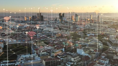 smart city communication concept,aerial view of 5G wired network growing over cityscape,wifi signal motion graphic animation with urban background,milan italy