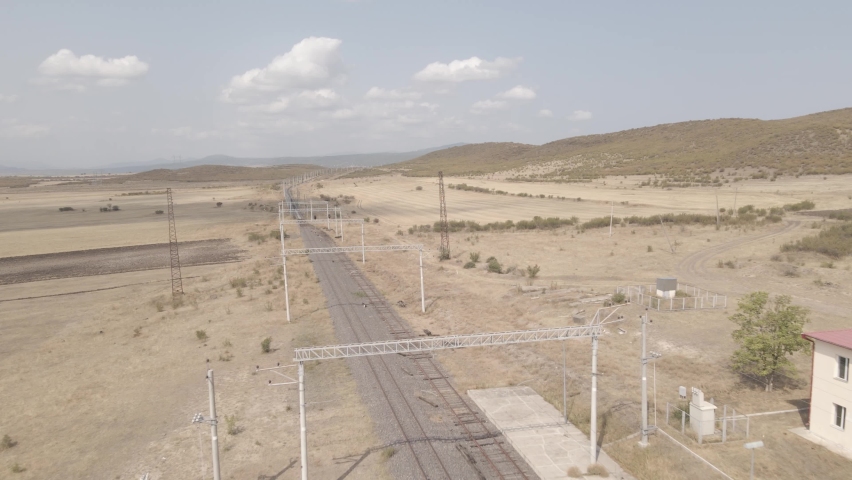 Moving along railroad tracks. Aerial view of empty Railway lines in Samtskhe-Javakheti region of Georgia. 