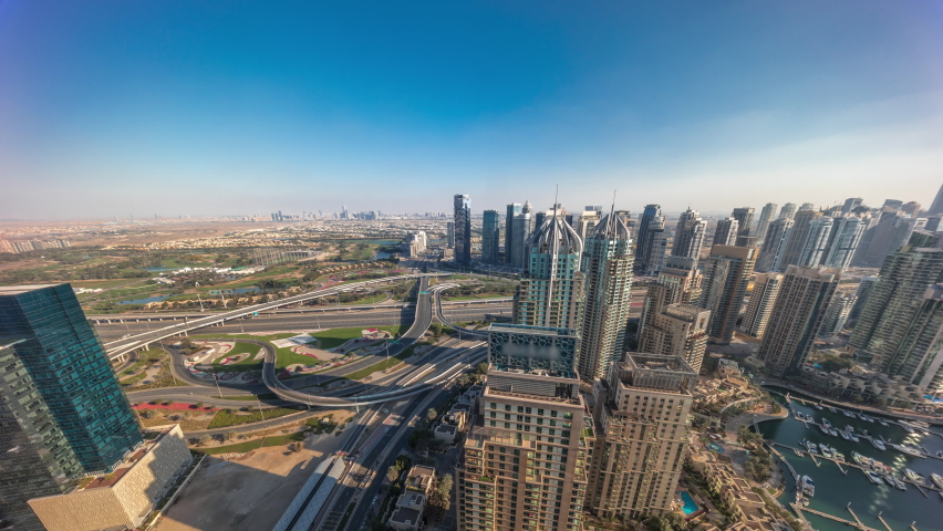Dubai marina and JLT skyscrapers panorama along Sheikh Zayed Road aerial timelapse. Residential and office buildings with long shadows from above. | Shutterstock HD Video #1079948051