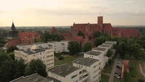 Malbork,Poland.Aerial 4K video from drone to Medieval Malbork ( Zamek w Maborku, Ordensburg Marienburg ),castle in Poland fortress of the Teutonic Knights at the Nogat river in sunset light.(Series)