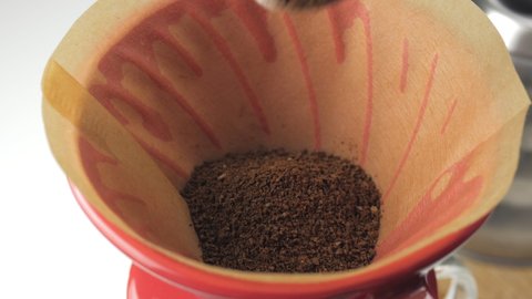Brewing coffee in a funnel by the purover method.