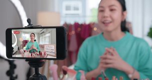 Asia woman micro influencer record live viral video camera at home studio. Happy youtuber fun talk speak advice review hobby in media. Vlogger selfie shoot enjoy work show smile teach like share app.