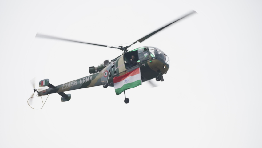 Indian flag on Indian Army Helicopter on Indian army officers passing out parade at Indian Military Academy IMA 2021. High-quality Apple prores 4k slow-motion footage. 