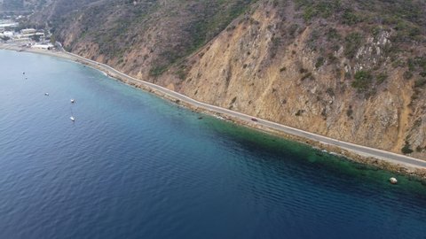 Aerial View of Santa Catalina Island Rocky Coastline Highway and Deep Blue Ocean, Established shot