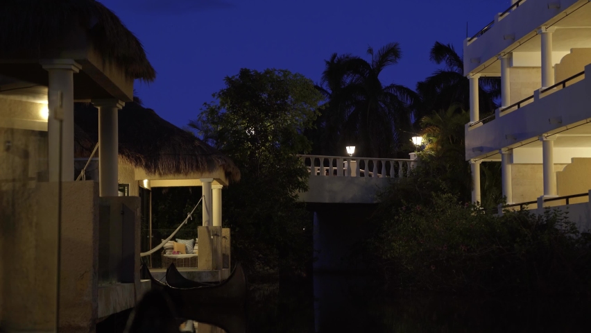 Stunning tranquil night time scene of small tropical bungalow