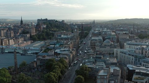 Descending drone shot of Edinburgh to reveal Dugald stewart monument Calton hill view point
