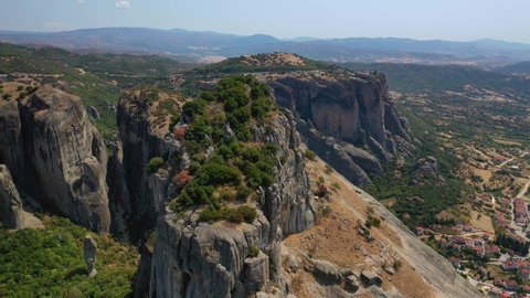 Aerial drone video of iconic Meteora rock formation complex of immense natural pillars and hill-like rounded stones, an Unesco World Heritage site, Thessaly, Greece