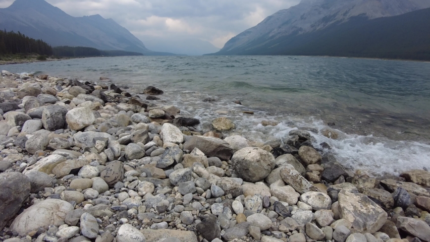 Spray Lakes Reservoir in Kananaskis, Alberta, Canada on a stormy cloudy day. Man-made reservoir surrounded by Canadian Rocky Mountains near Canmore and Banff. 