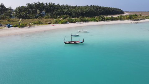 drone shot around boat in maldives