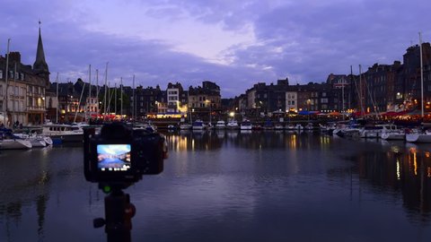 Honfleur, France - July 28, 2021: The camera captures the port of Honfleur in Normandy at blue hour.