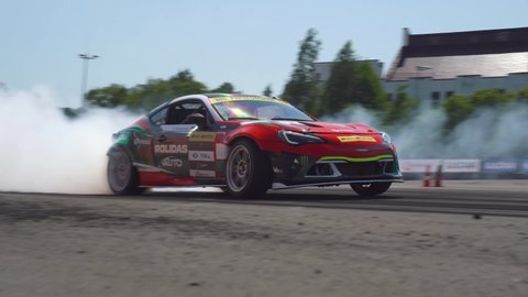 MINSK, BELARUS, June 20, 2021: car drifting with lots of smoke during drift competition,
Belarusian Drift Championship Stage 3
