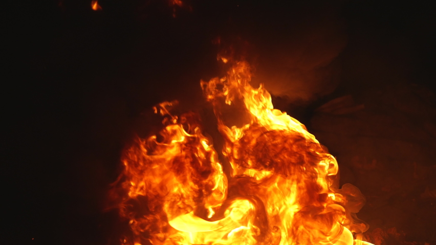 Fire and flames from burning rubber on dark background. Heat footage for templates and alpha channel editing pattern. Bonfire chromakey texture overlay, render mask. Transparent mockup loop of fires.