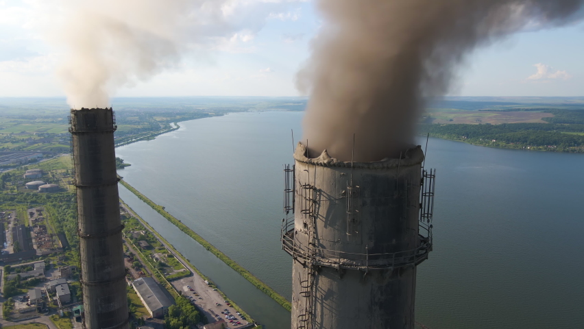 Aerial view of coal power plant high pipes with black smokestack polluting atmosphere. Electricity production with fossil fuel concept. Royalty-Free Stock Footage #1080002162
