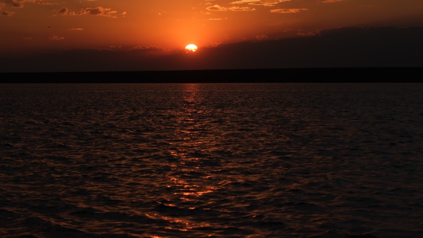
sunset, seagulls flying, lake, sun and mountain