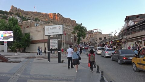 Mardin, Turkey - 15th of June 2021: 4K On the central street of old Mardin city one hot evening
