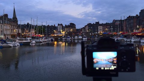 Honfleur, France - July 28, 2021: The camera captures the port of Honfleur in Normandy at blue hour.