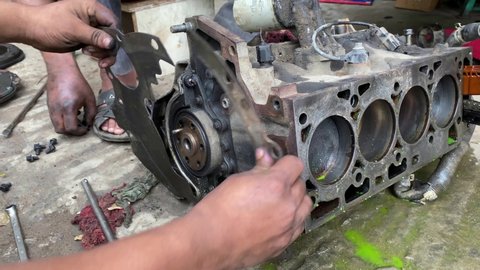 Mechanic disassembled Diesel engine flywheel, car engine repair by mechanic 
