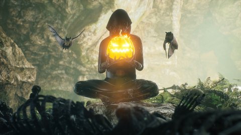 An old skeleton with a pumpkin in his hands and surrounded by bats meditates in a cave filled with ancient skeletal remains. The loopable animation is perfect for Halloween or apocalyptic backgrounds.