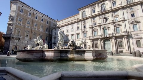 The Fontana del Moro (Moor Fountain) in Piazza Navona in Rome on a sunny morning. Famous tourist destination. Baroque sculpture and art in Rome
